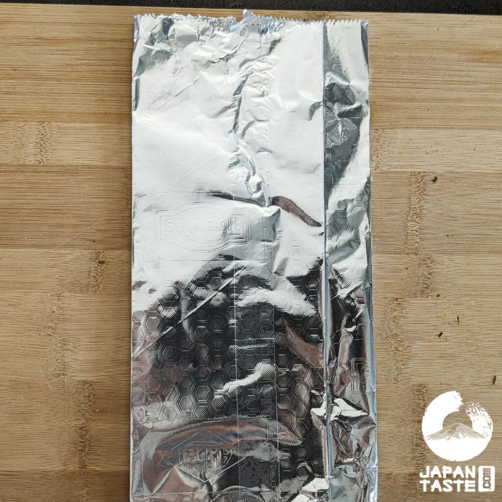 Place tape on the back of the foil and in the center